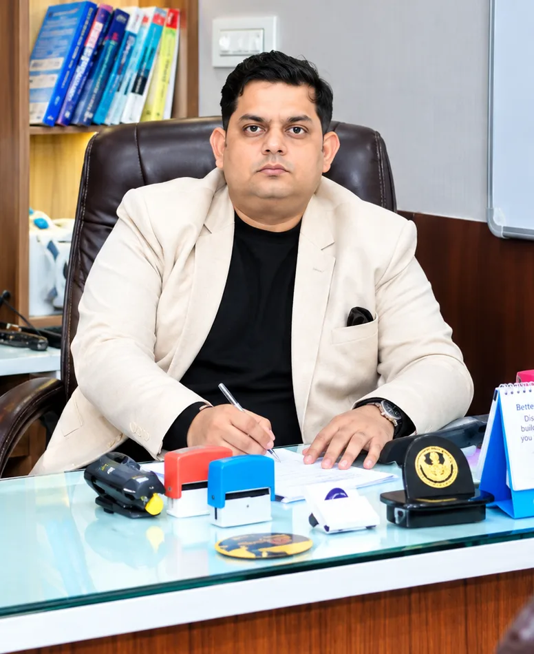 Dr. Rajat Goel, ENT & Head-Neck surgeon, at his consultation desk at Divine Hospital