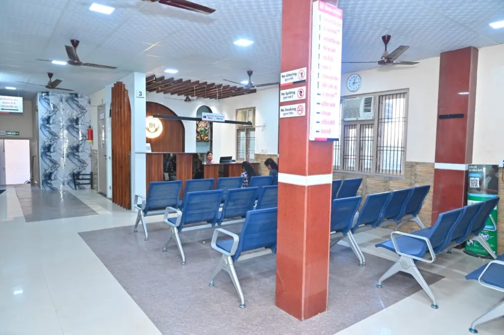 Spacious OPD waiting area with seating near the reception