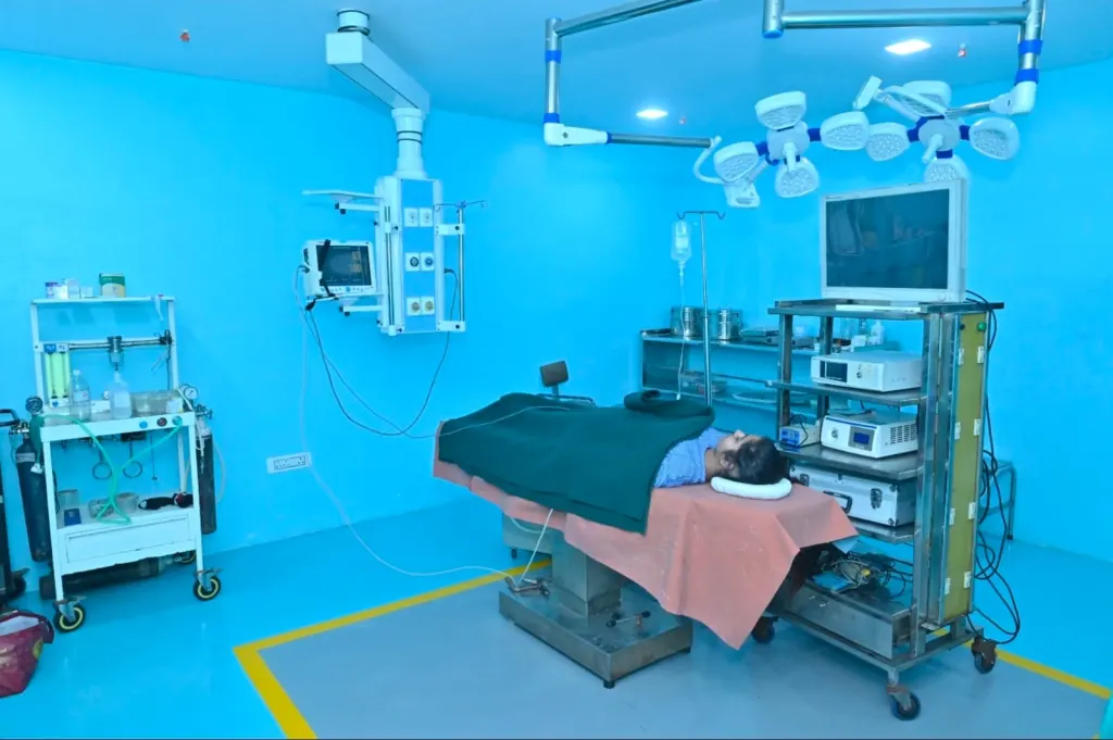 Operating theatre at Divine Hospital with surgical lights and endoscopy tower